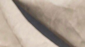 Federal immigration agents talk to Rebecca Torres after she tried to block a military vehicle during a raid in the agriculture area of Camarillo, Calif., Thursday, July 10, 2025. (AP Photo/Michael Owen Baker)