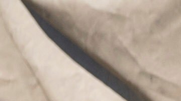 Federal immigration agents talk to Rebecca Torres after she tried to block a military vehicle during a raid in the agriculture area of Camarillo, Calif., Thursday, July 10, 2025. (AP Photo/Michael Owen Baker)