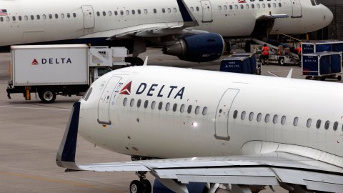 FILE - A Delta Air Lines plane leaves the gate July 12, 2021, at Logan International Airport in Boston. A Delta flight from Detroit to Amsterdam was diverted to New York's Kennedy Airport, Wednesday, July 3, 2024, after passengers were served spoiled food, airline officials said. (AP Photo/Michael Dwyer, File)
