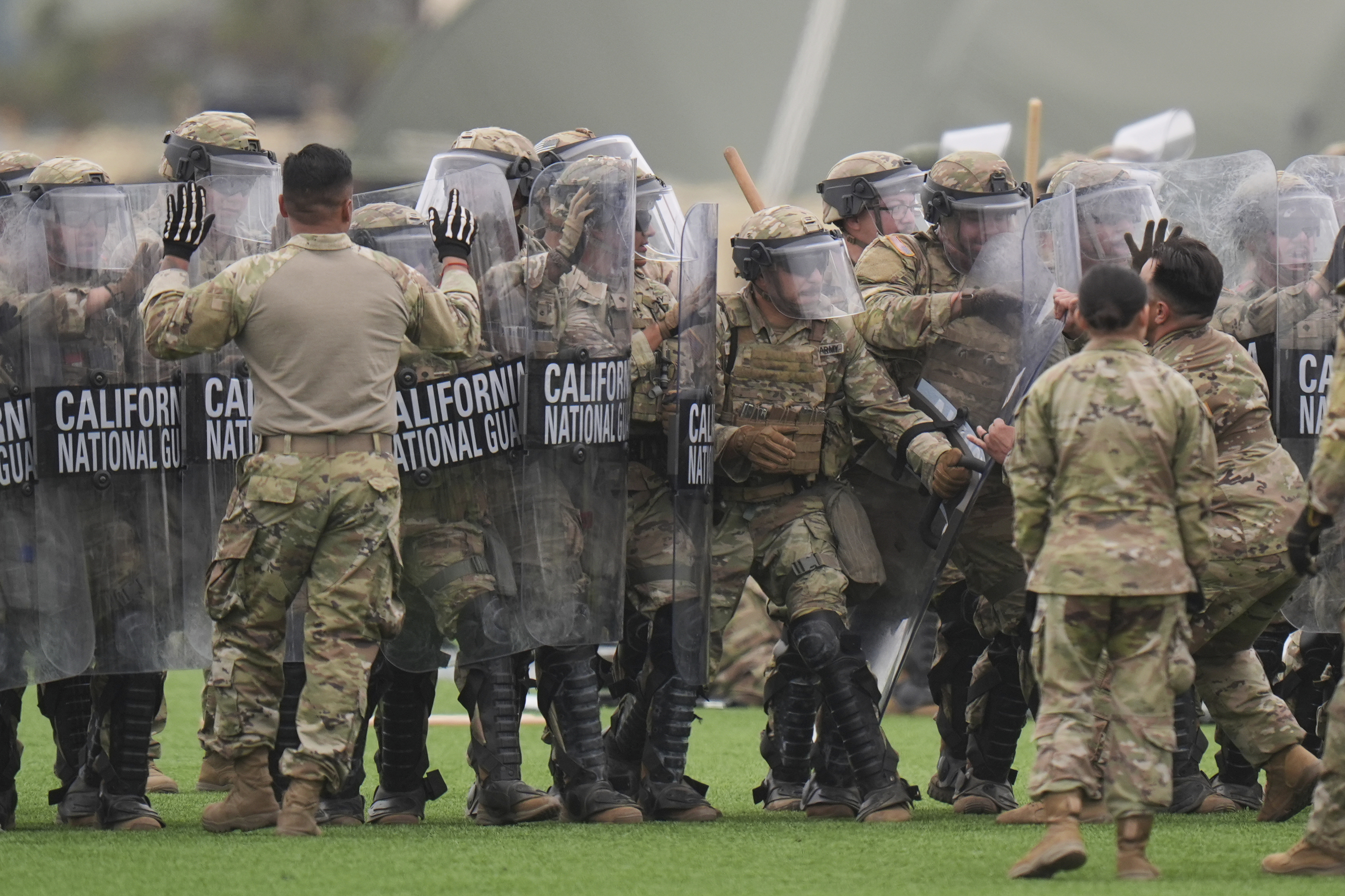 Members of the National Guard conduct exercises after being deployed to the Los Angeles protests Wednesday, June 11, 2025, in Los Alamitos, Calif. (AP Photo/Jae C. Hong)