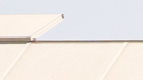 Workers walk outside of Glass House Farms, a day after an immigration raid on the facility, on Friday, July 11, 2025, in Camarillo, Calif. (AP Photo/Damian Dovarganes)