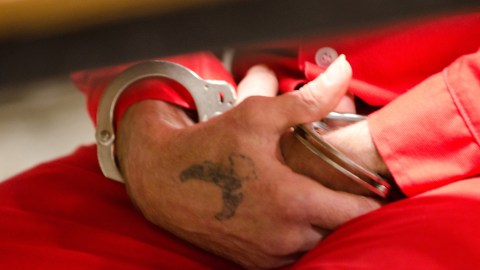 This Wednesday, Oct. 26, 2011 photo shows the handcuffed hands of Kentucky State Penitentiary death row inmate Randy Haight, 59, at the Eddyville, Ky. State Penitentiary. Kentucky's death row is aging and it's costing the state. The 35 condemned inmates have an average age of 50, which is 14 years older than inmates not condemned to death. While the state doesn't keep separate statistics for the death row population, medical expenses for the Department of Corrections rose each year since 2008, from $49.1 million that year to $54.8 million in fiscal year 2011. (AP Photo/Daniel R. Patmore)