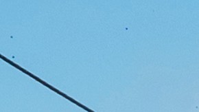 Federal immigration agents toss tear gas at protesters during a raid in the agriculture area of Camarillo, Calif., Thursday, July 10, 2025. (AP Photo/Michael Owen Baker)