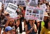 Demonstrators temporarily close the Sixth Street bridge after a rally at Hollenbeck Park calling for an end to the immigration raids by ICE in Los Angeles on Tuesday, July 1, 2025. (AP Photo/Damian Dovarganes)