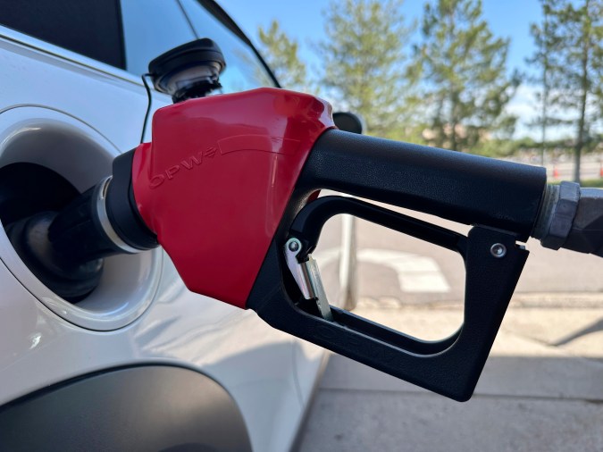 A motorist fills up the tank of a vehicle at the Costco warehouse gasoline station Wednesday, May 21, 2025, in Lone Tree, Colo. (AP Photo/David Zalubowski)