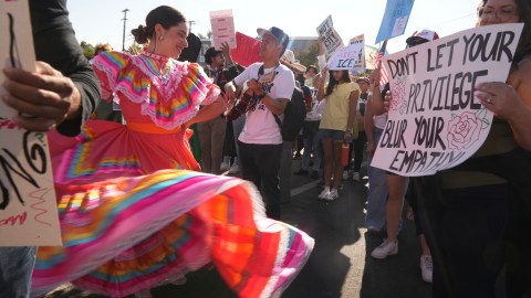Local musicians and traditional dancers join protesters on a walk around Mariachi Plaza during the "Reclaim Our Street" event to oppose ongoing ICE immigration raids in the Boyle Heights neighborhood of Los Angeles, Tuesday, July 1, 2025. (AP Photo/Damian Dovarganes)