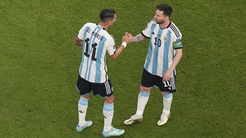 Argentina's Lionel Messi, right, talks with Argentina's Angel Di Maria ahead of the World Cup group C soccer match between Argentina and Mexico, at the Lusail Stadium in Lusail, Qatar, Saturday, Nov. 26, 2022. (AP Photo/Pavel Golovkin)