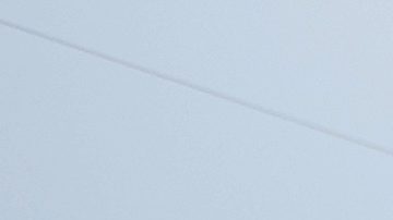 FILE - Two Barcelona fans wait for the start of a Spanish La Liga soccer match between Barcelona and Mallorca at the Camp Nou stadium in Barcelona, Spain, Sunday, May 28, 2023. (AP Photo/Joan Monfort, File)