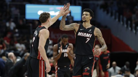 Miami Heat center Kel'el Ware (7) celebrates after his basket and a foul with guard Pelle Larsson, left, during the first half of an NBA basketball game against the Washington Wizards in Washington, Monday, March 31, 2025. (AP Photo/Terrance Williams)
