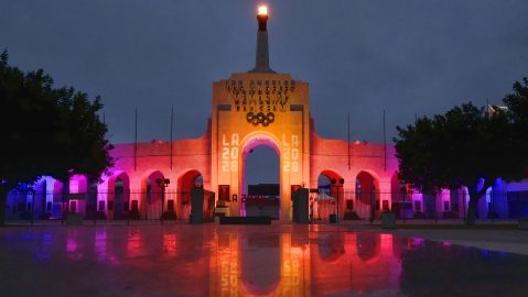 FILE - A blazing Olympic cauldron is seen at the Los Angeles Memorial Coliseum on Wednesday, Sept. 13, 2017. (AP Photo/Richard Vogel, File)