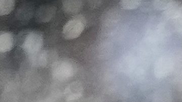 Paris Saint-Germain's goalkeeper Gianluigi Donnarumma watches as sprinklers spray the field during a break in the Club World Cup group B soccer match between PSG and Botafogo in Pasadena, Calif., Thursday, June 19, 2025. (AP Photo/Gregory Bull)