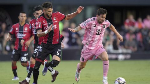 Inter Miami forward Lionel Messi, right, is pursued by Atlas defender Doria (5) during the first half of a Leagues Cup group stage soccer match, Wednesday, July 30, 2025, in Fort Lauderdale, Fla. (AP Photo/Rebecca Blackwell)