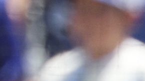 Los Angeles Dodgers' Freddie Freeman, left, is congratulated by Mookie Betts, center, and Shohei Ohtani after hitting a three-run home run against San Diego Padres pitcher Yu Darvish during the first inning of a baseball game, Sunday, Aug. 17, 2025, in Los Angeles. (AP Photo/Kevork Djansezian)