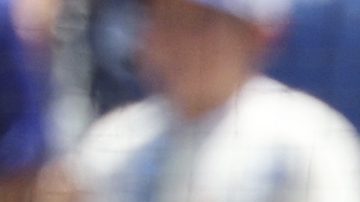 Los Angeles Dodgers' Freddie Freeman, left, is congratulated by Mookie Betts, center, and Shohei Ohtani after hitting a three-run home run against San Diego Padres pitcher Yu Darvish during the first inning of a baseball game, Sunday, Aug. 17, 2025, in Los Angeles. (AP Photo/Kevork Djansezian)