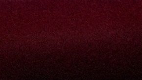 A fan of Universidad de Chile, center, is hit by fans of Argentina's Independiente during a Copa Sudamericana round of sixteen second leg soccer match at the Libertadores de America stadium in Avellaneda, Argentina, Wednesday, Aug. 20, 2025. (AP Photo/Gustavo Garello)