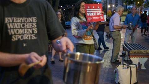 People hold a grassroots, daily, five-minute pots and pans protest to demonstrate against President Donald Trump's immigration policies.