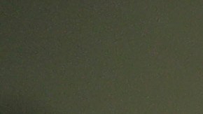 FILE - In this Aug. 28, 2019, photo, detainees, background, wait to be processed at the Adelanto ICE Processing Center in Adelanto, Calif. In a wind-whipped California desert town, a sprawling facility can house nearly 2,000 immigrant detainees facing the prospect of deportation. These days, however, the privately-run detention center in Adelanto is nearly empty. (AP Photo/Chris Carlson, File)