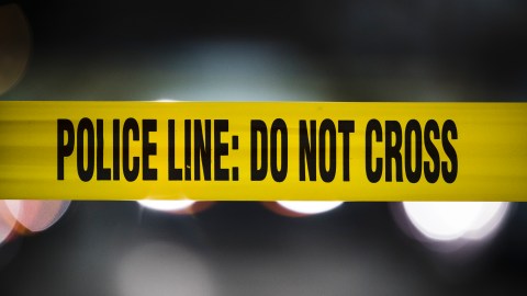 Police tape cordons off Woodstock Street where a woman was murdered on in Philadelphia, Friday, Dec. 14, 2018. (AP Photo/Matt Rourke)