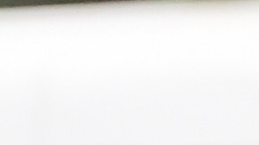 A U.S. Customs and Border Protection agent is filmed during an operation outside a Home Depot Friday, Aug. 15, 2025, in Los Angeles. (AP Photo/Gregory Bull)