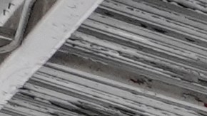 Immigration agents conduct arrests and check identifications at a car wash on Friday, Aug. 15, 2025, in Montebello, Calif. (AP Photo/Gregory Bull)