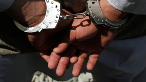One of five alleged suicide bomber is handcuffed as they are shown to the media at the Afghan National Police crisis unit's headquarters in Kabul, Afghanistan on Thursday, April 8, 2010. Afghan police arrested the five would-be suicide bombers Thursday in Kabul _ the largest suicide bomb team ever apprehended in the capital, officials said. (AP Photo/Musadeq Sadeq)