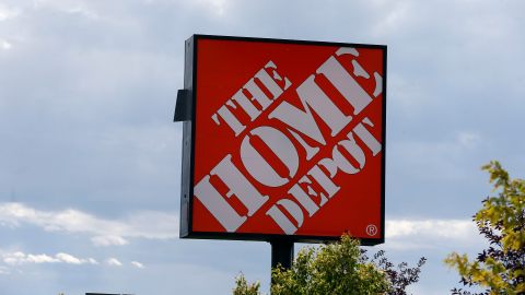 In this Aug. 27, 2019 photo, the Home Depot logo is shown on a store in Bloomington, Minn. The cost of the spreading coronavirus pandemic dragged on profits early in 2020 at Home Depot. (AP Photo/Jim Mone, File)