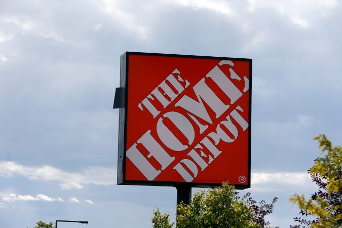 In this Aug. 27, 2019 photo, the Home Depot logo is shown on a store in Bloomington, Minn. The cost of the spreading coronavirus pandemic dragged on profits early in 2020 at Home Depot. (AP Photo/Jim Mone, File)