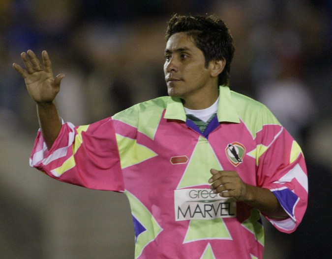 Retiring Mexican goalie Jorge Campos waves during the second half of an exhibition match between Brazil's 1994 World Cup team and Mexico's World Cup team from that year, Wednesday, Nov.10, 2004, at Los Angeles Coliseum. Campos played in goal during the first half and finished the game at forward. (AP Photo/Nick Ut)