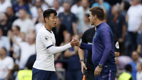 Tottenham's Son Heung-min, left, shakes hands with Tottenham's manager Mauricio Pochettino after scoring his side's third goal during their English Premier League soccer match between Tottenham Hotspur and Crystal Palace at White Hart Lane stadium in London, Saturday, Sept. 14, 2019. (AP Photo/Alastair Grant)