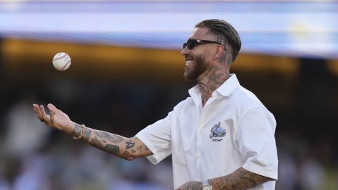 Soccer player Sergio Ramos tosses the ball before throwing out the ceremonial first pitch prior to a baseball game between the Los Angeles Dodgers and the San Diego Padres, Wednesday, June 18, 2025, in Los Angeles. (AP Photo/Mark J. Terrill)