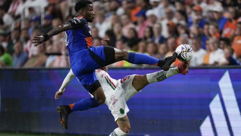 FC Cincinnati defender Alvas Powell, top, and Chivas Guadalajara defender Bryan Gonzalez, bottom, battle for the ball during the first half of a Leagues Cup soccer match, Thursday, Aug. 7, 2025, in Cincinnati. (AP Photo/Carolyn Kaster)