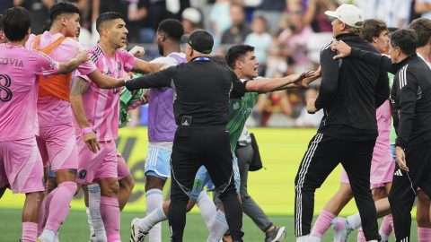 Inter Miami forward Luis Suárez, third from left, is separated from Seattle Sounders players and staff as Sounders midfielder Kalani Kossa-Rienzi, center right facing, holds a staff member back during a fight after the Sounders won the Leagues Cup final soccer match Sunday, Aug. 31, 2025, in Seattle. (AP Photo/Lindsey Wasson)