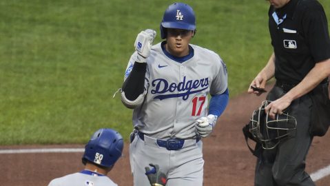 Los Angeles Dodgers' Shohei Ohtani (17) returns to the dugout after after hitting a solo home run off Pittsburgh Pirates pitcher Bubba Chandler during the third inning of a baseball game in Pittsburgh, Tuesday, Sept. 2, 2025. (AP Photo/Gene J. Puskar)
