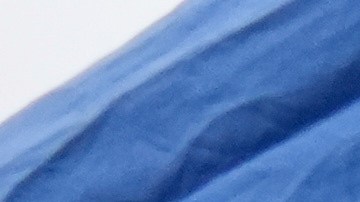 A woman is detained by U.S. Border Patrol agents outside a Home Depot Friday, Aug. 15, 2025, in Los Angeles. (AP Photo/Gregory Bull)