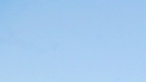 A Riverside County Sheriff's deputy photographs a charred vehicle that might have started the 46 Fire after a police chase is seen in Rancho Jurupa Park Thursday, Oct. 31, 2019, in Riverside, Calif. Authorities say suspects driving a stolen car during a police pursuit pulled their damaged vehicle into a field and ignited a brush fire that spread and prompted evacuations in nearby Jurupa Valley. (AP Photo/Marcio Jose Sanchez)