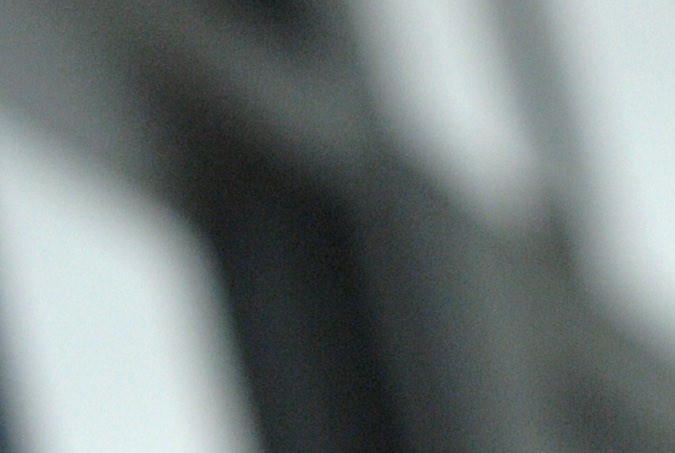 A man, detained for illegal border crossing, holds a bar in the detention center of the Hungarian Border Guard in Nyirbator, Hungary, near the Ukrainian border (260 km east of Budapest) April 12, 2007. ungary is prepared to reinforce its non-EU borders and will join the Schengen Agreement and its Information System (SIS), a central database, at the beginning of 2008. The Schengen system is an agreement among European states which allows the abolition of systematic border controls between the participating countries while they guard the external borders heavily. (AP Photo/Bela Szandelszky)