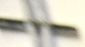 FILE - In this Nov. 14, 2013 file photo, a corrections officer stands near a gate at Baltimore City Detention Center in Baltimore. Inside the Baltimore City Detention Center, gang members used smuggled cellphones, dealt drugs and had sex with corrupt guards  several of whom they impregnated  who helped them as they ran operations of the Black Guerilla Family, according to court papers in a case alleging widespread corruption at the state-run facility. (AP Photo/Steve Ruark, FIle)