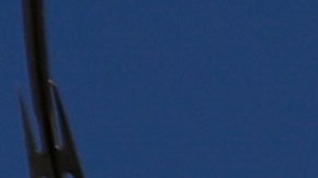 In this Wednesday, Aug. 28, 2019, photo shows chain-link fence and razor wire surrounding the exercise fields at the Adelanto ICE Processing Center in Adelanto, Calif. The facility is a privately operated immigration detention center run by the GEO Group, which can house up to about 1900 total immigrant detainees, both male and female.(AP Photo/Chris Carlson)