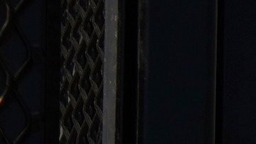Fences are placed outside the the Metropolitan Detention Center Tuesday, Sept. 2, 2025, in Los Angeles. (AP Photo/Damian Dovarganes)