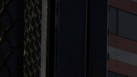 Fences are placed outside the the Metropolitan Detention Center Tuesday, Sept. 2, 2025, in Los Angeles. (AP Photo/Damian Dovarganes)