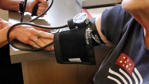 FILE - In this June 6, 2013, file photo, a patient has her blood pressure checked by a registered nurse in Plainfield, Vt. New medical guidelines announced Monday, Nov. 13, 2017, lower the threshold for high blood pressure, adding 30 million Americans to those who have the condition. (AP Photo/Toby Talbot, File)