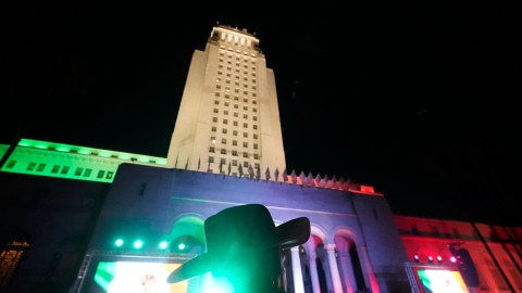 People celebrate the annual independence shout to kick off Mexico's Independence Day celebrations on the steps of City Hall in Los Angeles, Thursday, Sept. 15, 2022. (AP Photo/Damian Dovarganes)