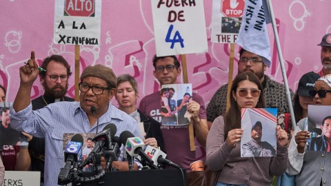 Pablo Alvarado, Co-Executive Director, National Day Laborer Organizing Network (NOLON) at podium, joins family members of carwash workers, members of the CLEAN Carwash Worker Center and community leaders at a news conference in Los Angeles on Thursday, Sept. 11, 2025, to denounce U.S. Immigration and Customs Enforcement detentions at the now-shuttered La Cienega Carwash. (AP Photo/Damian Dovarganes)