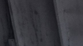 Immigration agents detain two men at a car wash on Friday, Aug. 15, 2025, in Montebello, Calif. (AP Photo/Gregory Bull)