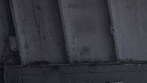 Immigration agents detain two men at a car wash on Friday, Aug. 15, 2025, in Montebello, Calif. (AP Photo/Gregory Bull)