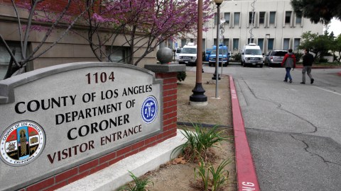 News vans line the parking lot of the Los Angeles County Coroner's office where Whitney Houston's body remains in Los Angeles, Monday, Feb.,13, 2012. Coroner's officials said they will not release any information on an autopsy performed Sunday at the request of police detectives investigating the singer's death. Houston was found in the bathtub of her room, but Assistant Chief Coroner Ed Winter declined to say anything more about the room's condition or any evidence investigators recovered. (AP Photo/Nick Ut)