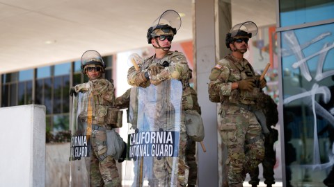 National Guard stand guard near the metropolitan detention center Monday, June 9, 2025, in downtown Los Angeles. (AP Photo/Eric Thayer)
