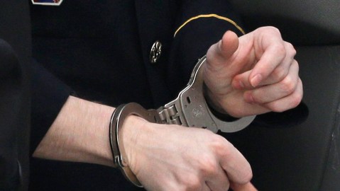 Army Pfc. Bradley Manning wears handcuffs as he is escorted into a courthouse in Fort Meade, Md., Wednesday, Aug. 21, 2013, before a sentencing hearing in his court martial. Manning was sentenced Wednesday to 35 years in prison for giving hundreds of thousands of secret military and diplomatic documents to WikiLeaks. (AP Photo/Patrick Semansky)