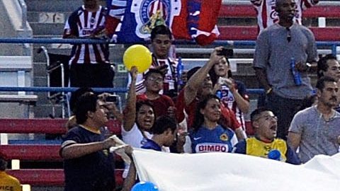 Club America soccer fans cheer before the first half of the El Super Clasico soccer match on Wednesday, July 3, 2013 in Las Vegas. Chivas defeated Club America 1-0. (AP Photo/David Becker)