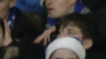 Chelsea fans, wearing Christmas themed hats, watch as Southampton's Fraser Forster takes a goal kick during the English Premier League soccer match between Chelsea and Southampton at Stamford Bridge in London, Saturday Dec. 16, 2017. (AP Photo/Tim Ireland)